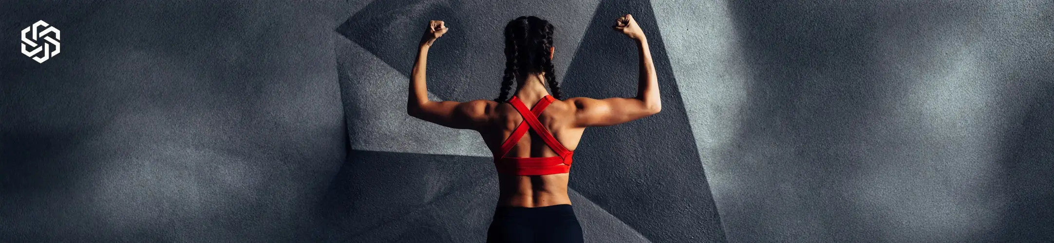Woman in athletic clothing representing body confidence and wellness goals