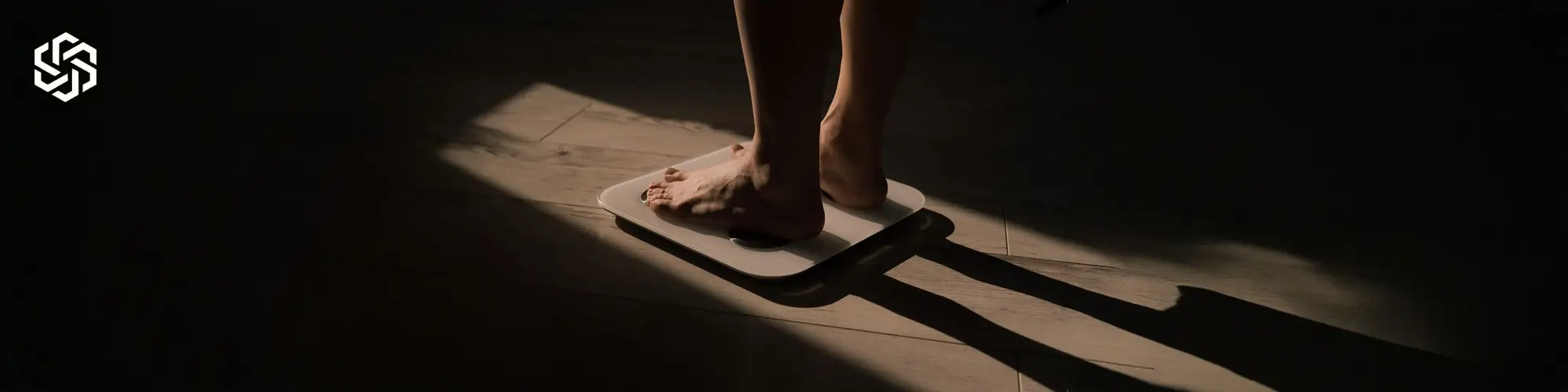 Person standing on scale representing weight loss supported by Weight management