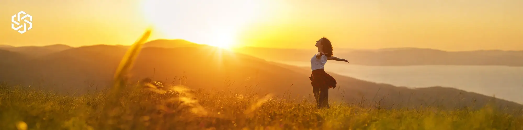 Woman outdoors at sunrise representing wellness goals and personalized hormone management support